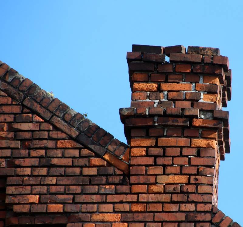 Signs Your Garland Home Needs a Chimney Inspection Damaged chimney on an Garland home showing cracks and missing mortar